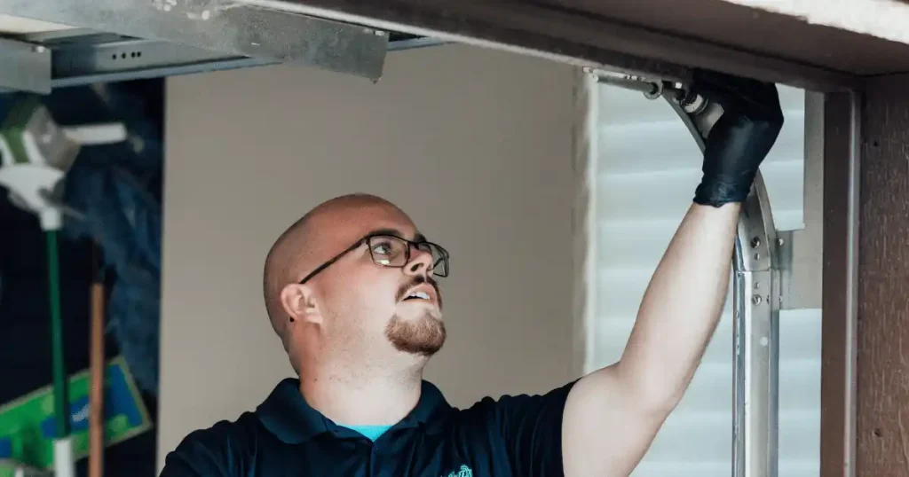 expert checking garage door